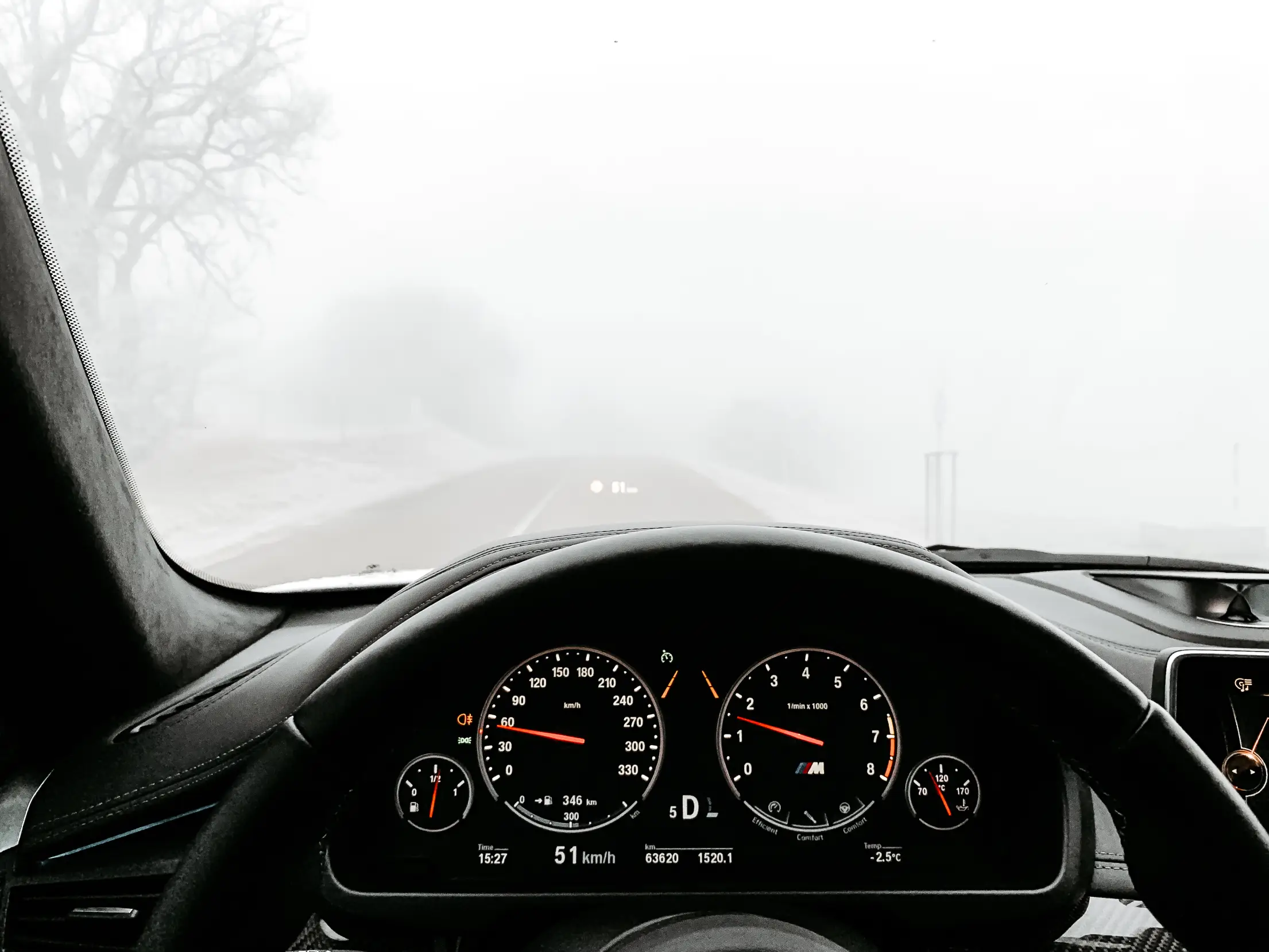 car driving in heavy fog